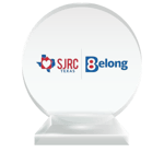 The SJRC | Belong professional logo printed on a round crystal trophy to represent their charter membership status with the National Center for Community-Based Child Welfare. 