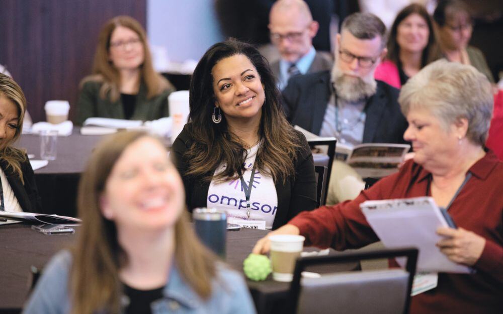 Members of the National Center for Community-Based Child Welfare listen to a presentation by the executive leadership at the 2024 annual symposium. 