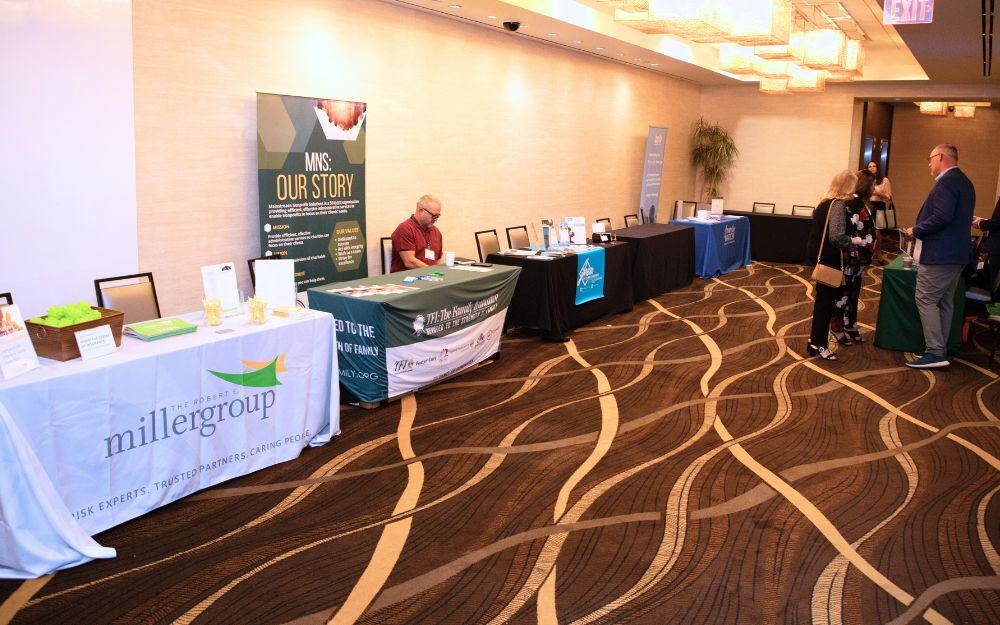 Booths provided by sponsors and partners at the annual symposium of the National Center for Community-Based Child Welfare. 